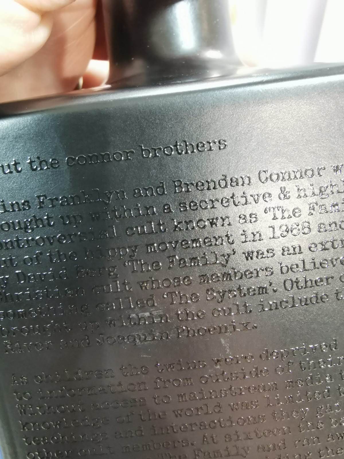 UV print on the powder-coated bottle — full artist text laid down crisp on the matte finish.