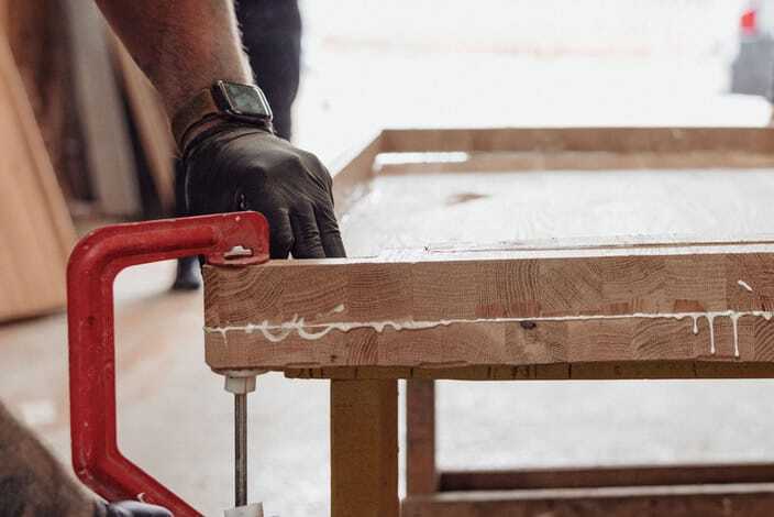 Clamped during glue-up — building stock thick enough to carve a book from.