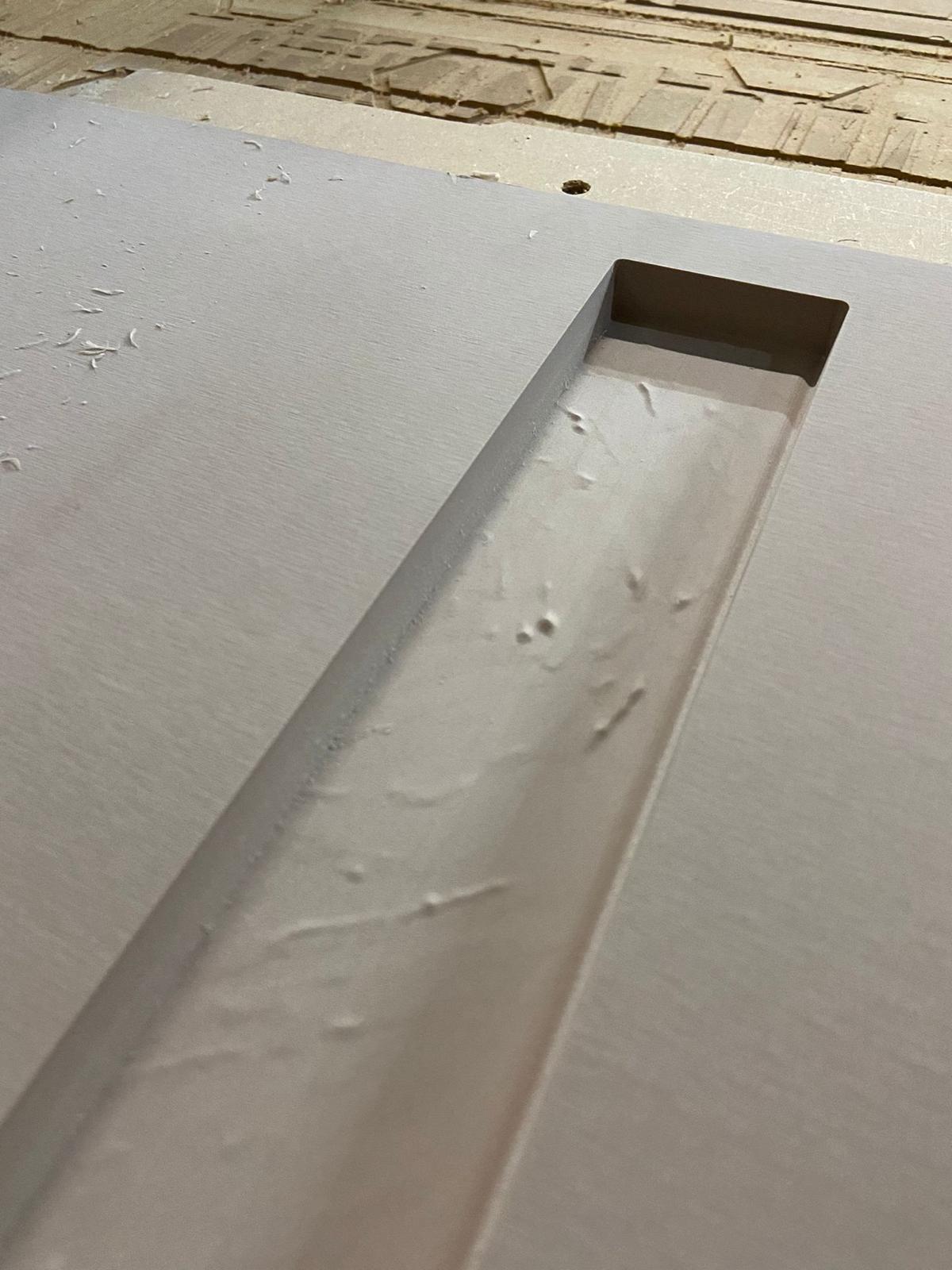 CNC machining the texture into solid substrate — first pass before print.