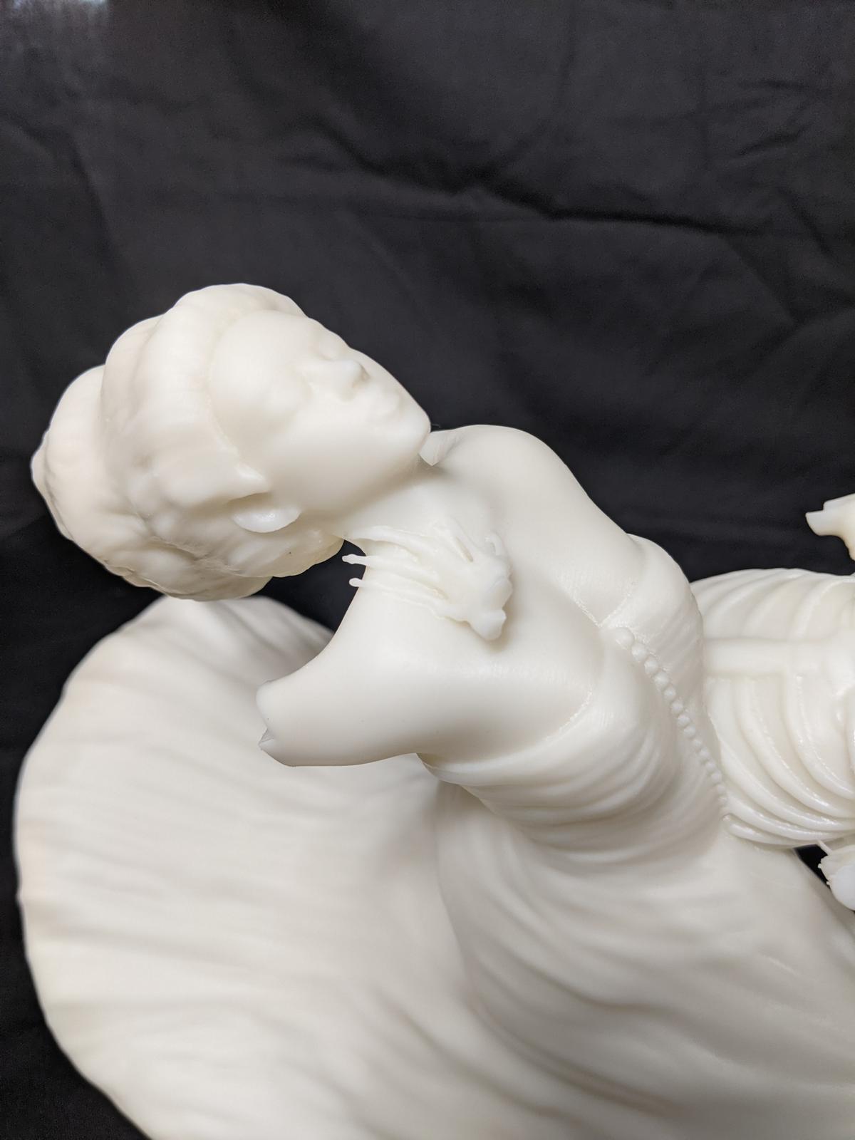 Face detail — sculpted to carry through the casting process.