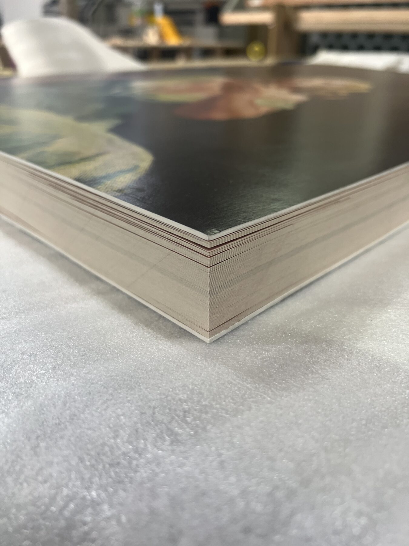 Page stack — heavyweight card chosen to hold the hand-feel of the original.
