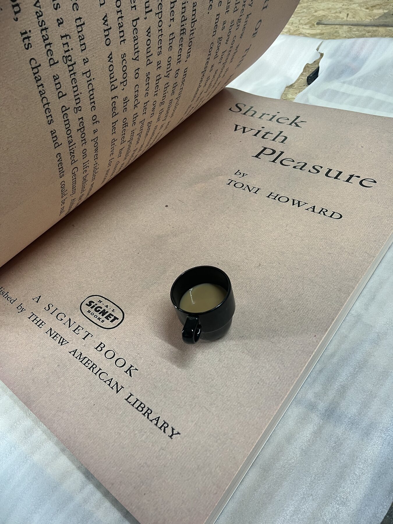 Title page at scale. Espresso cup for reference.
