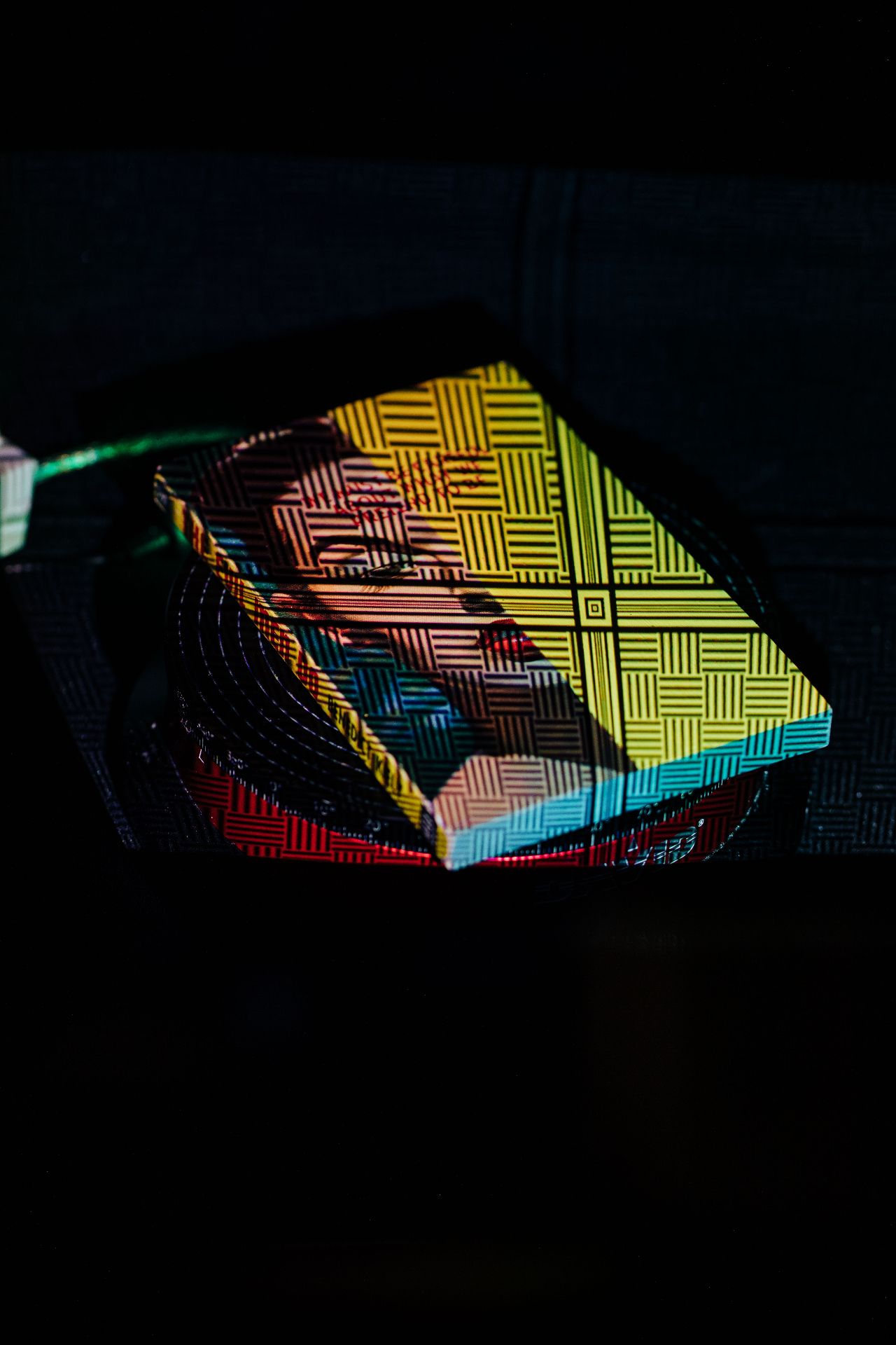 First proof under raking light — print laid down clean across the cover.