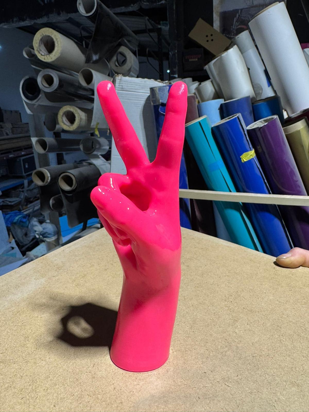 On the workshop floor — edition piece sat in front of the print vinyl racks.
